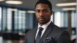 Portrait of a very serious black guy lawyer with blurred modern law firm office background from Generative AI