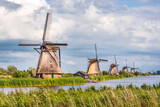 General view of the Overwaard windmills, part of the Kinderdijk mills  near Rotterdam, Netherlands, built in 1740 to drain the Alblasserwaard polder, under a stormy sky.