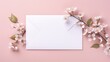 An envelope adorned with flower branches has an inscription for spring