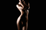 Nude Woman silhouette in the dark. Beautiful Naked Body Girl