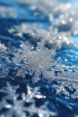Poster - A detailed close-up of a snowflake on a smooth blue surface. Perfect for winter-themed designs and holiday greetings