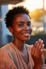 Aufkleber - A woman sitting at a table, her hands clasped together. This image can be used to depict concentration, meditation, or prayer