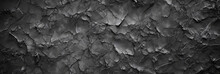 Panoramic Black Stone Background Banner Design. Dark Rock Grunge Texture. Mountain Surface Close-up Cracked Empty Copy Space