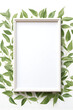 Close-up and top view of a empty frame in the style of neutral colors, and greenery leaves pattern at the back with white background.