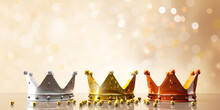 Three Gold Shiny Crowns On Festive Background.3d Illustration.