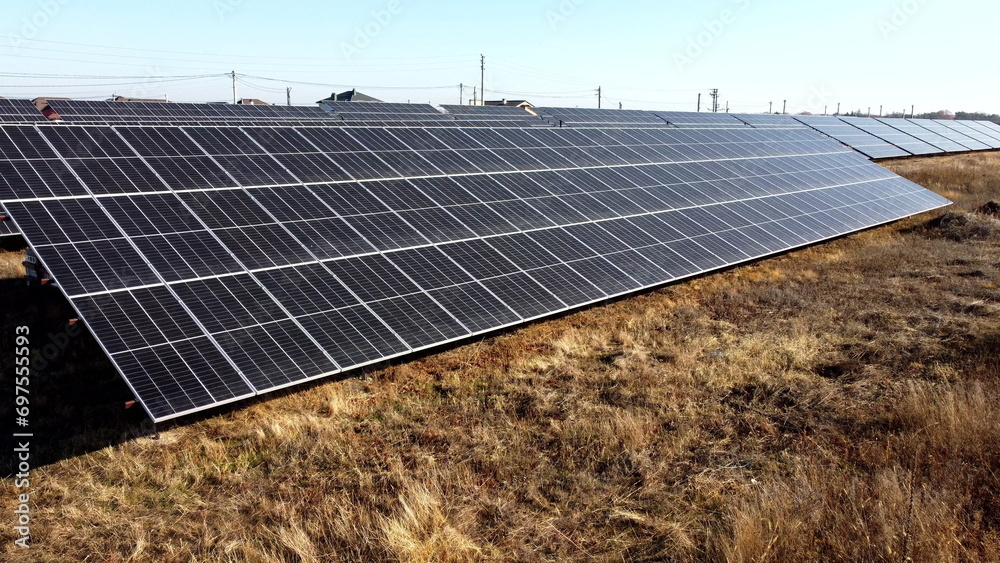 Solar power plant. Flight over modules of solar power station on sunny ...