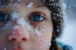 snowflakes on a child's face, generated ai