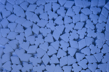 Colored Sugar in poker shapes texture background