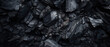 © Purple_Lamp - Close-up of a dark, heavy heap of varied coal.