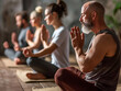 group of yogis sitting together and meditating
