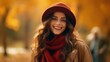 Close up portrait of a beautiful young woman in hat and scarf walking in autumn park