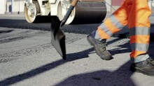 Road Paving On Residential Street. Asphalt Laying. Road Building Asphalt Paver Is Laying 