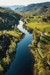 Aufkleber - A picture of a river running through a beautiful and vibrant green valley. Perfect for nature and landscape enthusiasts.