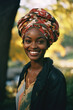 © MaryAnn - headshot of beautiful african american poc-woman with dark skin and retro vintage clothes/head scarf/turban in a park in magazine fashion beauty editorial portra film look