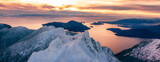 Fototapeta  - Snow Covered Mountains on Pacific Ocean Coast. Aerial Canadian Winter Landscape
