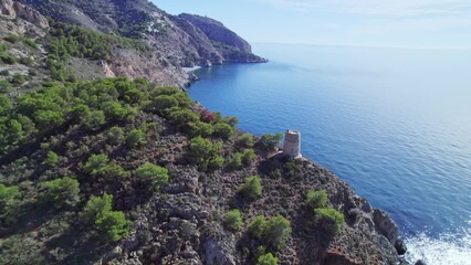 Wall Mural - Seaside cliffs and medieval watchtowers. Historical ruins by the sea. Mediterranean sea. Andalusia. Spain.