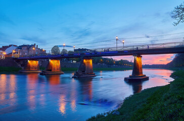 Canvas Print - Illuminated pedestrian bridge in the center of Uzhgorod