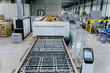 Conveyor production of large sheets of cut glass. Cutting, washing, framing, tempering of glass by machine on a conveyor line. Without human intervention. General view of plant