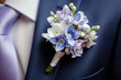 groom's boutonniere with periwinkle   flower 