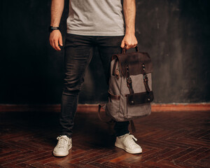 Man hold Canvas Backpack accessories. Hand made backpack for travelers.