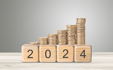 Poster - flipping year wooden block and Coins stack.