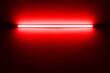 © Sirinart - Red neon lamp on a white wall for design