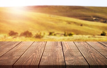 Wall Mural - the empty wooden table top at farm background