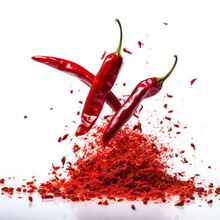 Red Hot Chili Pepper Flakes Bursting Out On White Background.