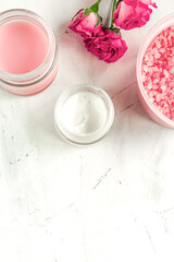 Wall Mural - rose salt and cream for nail care in spa on white background mockup