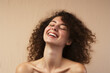 © RJ.RJ. Wave - portrait of a beautiful happy smiling young woman isolated on beige background. skin care beauty, skincare cosmetics concept