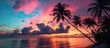 © AkuAku - Stunning sunset in the Bahamas with palm tree silhouettes against a colorful sky.
