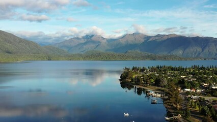 Wall Mural - Calm waters of Te Anau lake in Fiordland on South island of New Zealand – aerial 4k.
