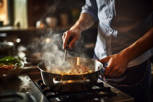 Man Cooking On His Stove In The Kitchen At Home