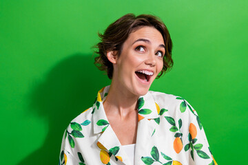 Sticker - Photo of astonished cheerful girl wear trendy clothes rejoicing unexpected cool proposition isolated on green color background