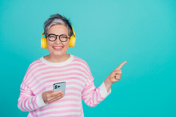 Sticker - Photo of cool cheerful woman dressed pink pullover earphones listening melody gadget empty space isolated teal color background