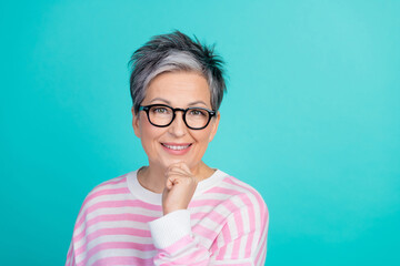 Poster - Photo of smart clever lady wear striped sweater spectacles arm hand chin empty space isolated turquoise color background