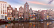 Amsterdam canal Herengracht with typical dutch houses at sunset, Holland, Netherlands.