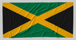 Flag of Jamaica. Fabric textured Jamaica flag isolated on white background. 3D illustration