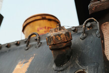 Close Up Photo Of Old Rusted Metal Yellow Tractor Bulldozer.
