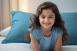 © Neha - Cute indian little girl smiling while relaxing on bed