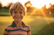 Portrait of a caucasian boy at golfing training lesson looking at camera on golf course