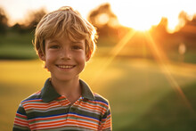 Portrait Of A Caucasian Boy At Golfing Training Lesson Looking At Camera On Golf Course