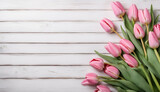 Fototapeta Tulipany - Pink Tulips on white wooden background with copy space