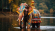 a beautiful large Indian elephant, decorated with multi-colored patterns, stands in the river, sacred animal, India, ornament, religious tradition, floral decor, paint, nature, trunk, ears, mammal