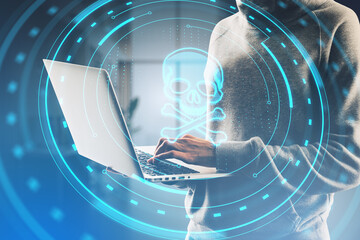 Canvas Print - Close up of hacker hands using laptop with abstract round skull interface on blurry office background. Hacking and threat concept. Double exposure.