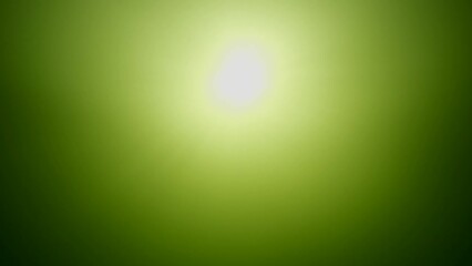 Wall Mural - Underwater sun rays in the green surface of water, Real time. Bottom view on green water surface with sun. View of sun light from the deep. Light filters down through yellow water