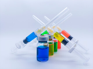 Colorful glass syringes and vials, isolated on a white background. Focus stacking, Full depth of field.