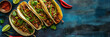 Mexican tacos, street food. Cinco de Mayo, Mexican fiesta, The taco festival. Flat lay composition on blue background.  Banner with copy space.