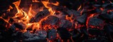 Fototapeta  - Burning firewood and coals of a fire close up. Background for grilled food with fire.