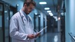 © WS Studio 1985 - Doctor and reading clipboard with documents of research, healthcare schedule and test results in hospital